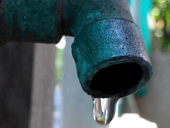 Close-up of water drop from pipe