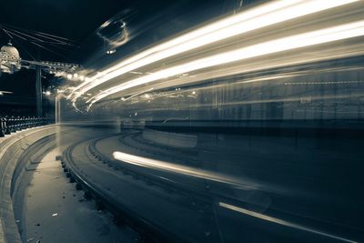 Light trails on road in city at night