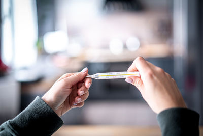 Close-up of woman holding hands