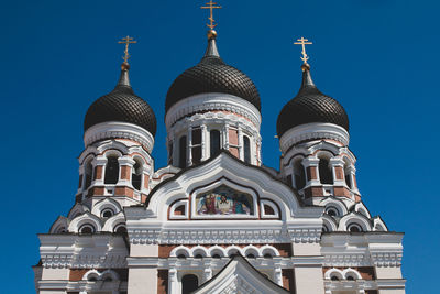 Low angle view of building against blue sky