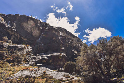 Low angle view of rocks against sky