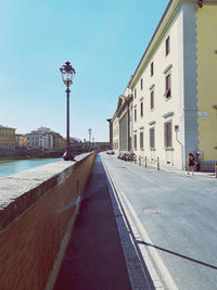 Street amidst buildings against sky