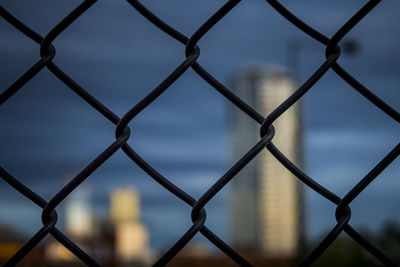 Full frame shot of chainlink fence against sky