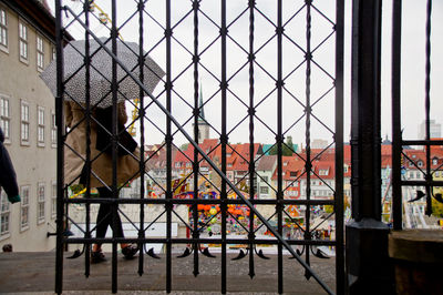 Man seen through window