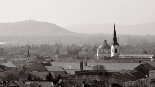 Buildings in city against sky
