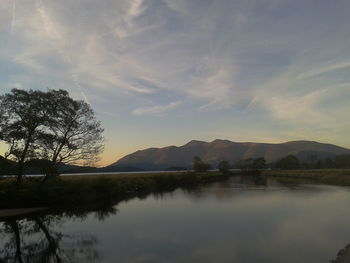 Scenic view of lake against sky during sunset