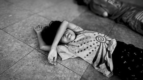 Low section of woman sitting on floor