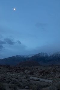 Scenic view of mountains against sky at night