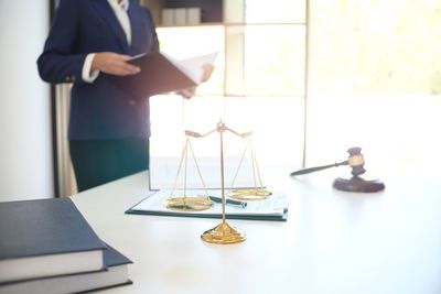 Weight scale on table with lawyer in background