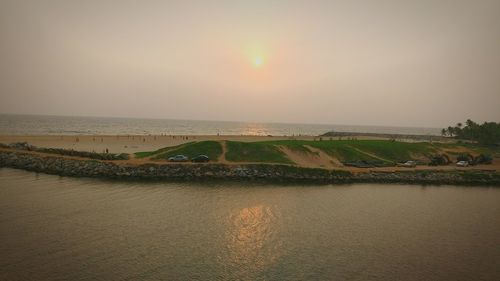 Scenic view of sea against clear sky during sunset