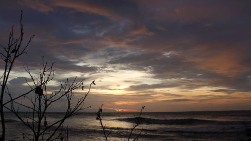 Scenic view of sea against sky at sunset