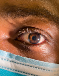 Close up of african american man dark brown eyes for use in ophthalmology optometry imagery