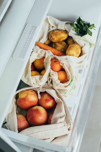 High angle view of apples in refrigerator