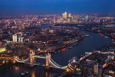 Aerial view of illuminated city at night