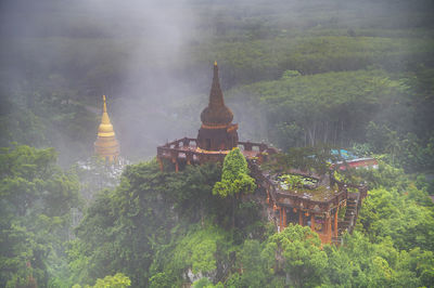 Scenery view of foggy palm and rubber plantations on limestone mountains