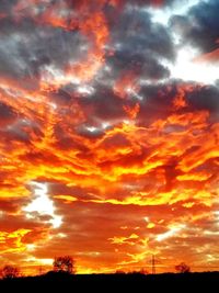 Low angle view of dramatic sky during sunset