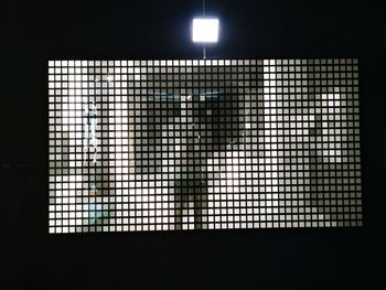Low angle view of illuminated window in building