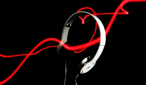 Close-up of red light over black background