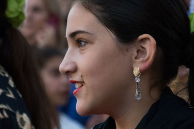 Close-up of women looking away while talking during festival