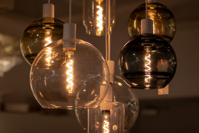Close-up of light bulb on table