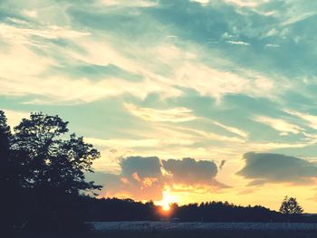 Scenic view of silhouette trees against sky during sunset