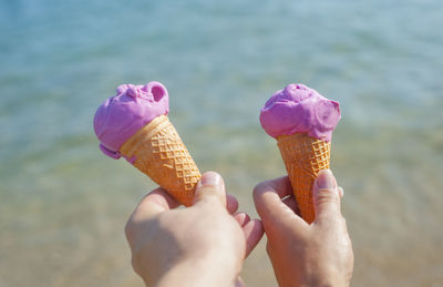 Midsection of person holding ice cream