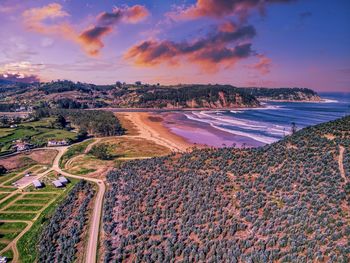 High angle view of beach against sky during sunset