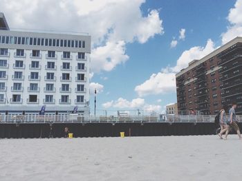 City street against cloudy sky