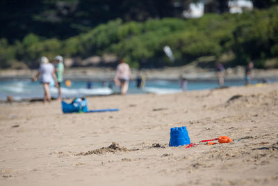 Deck chairs on sand at beach