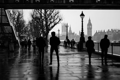 Silhouette of people walking on water