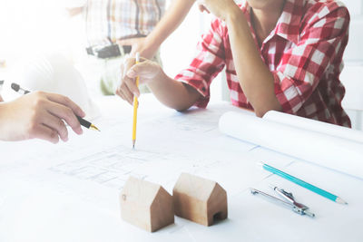 Architects planning in conference room at office