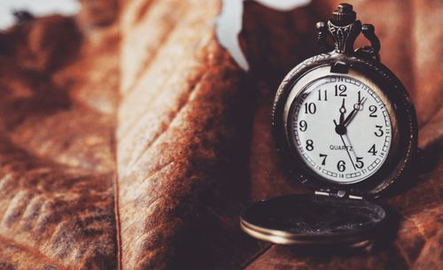 Close-up of clock on table