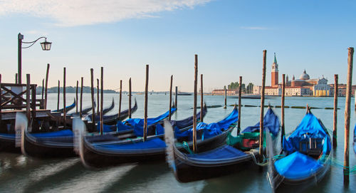 Boats moored at dock