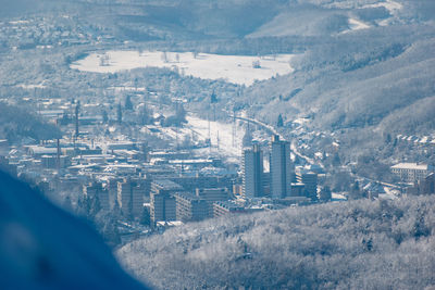 High angle view of buildings in city during winter