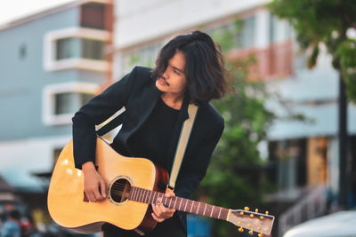 Young man playing guitar