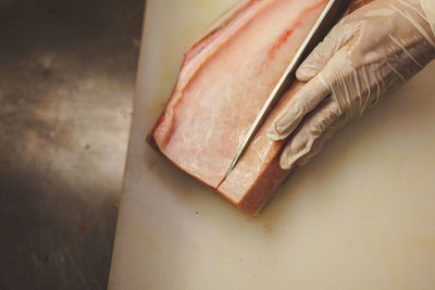 Cropped hand of person cleaning equipment