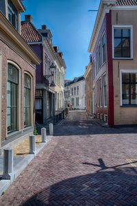 Footpath amidst buildings in town