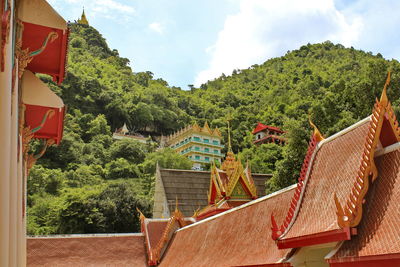 Panoramic view of trees and houses against sky