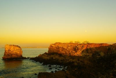 Scenic view of sea at sunset