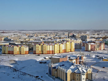 High angle view of townscape against sky during winter