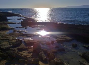 Scenic view of sea against clear sky during sunset