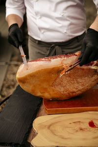 Midsection of man holding food