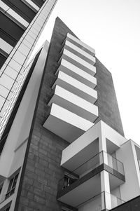 Low angle view of office building against sky