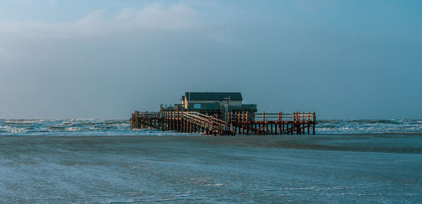 Pile dwelling on the beach of sankt peter-ording in germany.