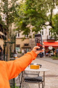 Midsection of woman using mobile phone