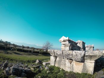 Old ruins against clear blue sky