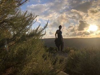 Full length of man standing on land against sky