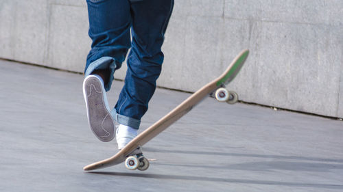 Low section of person skateboarding in park