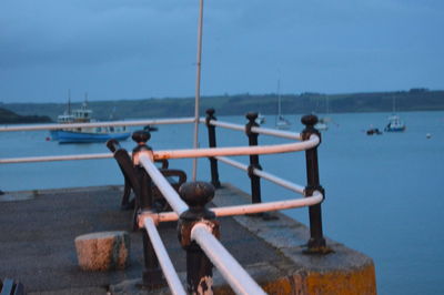 Close-up of nautical vessel on sea against sky