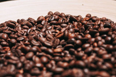 Close-up of coffee beans on table